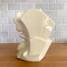 Load image into Gallery viewer, Rare vintage mid-century gloss pink tint magnolia vase with green leaves. Crafted by McCoy Pottery, USA, 1953. This special piece is must for any art pottery collector!

In as found used vintage condition. This vase has several cracks and a repair. Still displays well. Maker&#39;s mark.

Measures 7 x 3 1/2 x 8 1/4 inches
