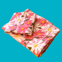 Load image into Gallery viewer, Lovely vintage twin size 100% cotton sheet set features raspberry pink and white daisy flowers on a pales pink ground. Made in Canada, 1970s. A beautiful way to add charm to your bedroom decor or repurpose for crafting!

Excellent used condition, colours are vibrant, no stains or tears.

Set includes

1 Flat Sheet, 72 x 90 inches
1 fitted sheet, twin mattress

1 pillowcase, 30 x 20 1/4 inches
