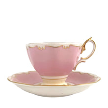 Load image into Gallery viewer, This vintage bone china footed teacup and saucer is so sweet! This teacup and saucer in the Malvern shape are hand painted in pink and pale yellow with a stylized gold git border. Produced by Royal Albert, England, circa 1960s. A lovely addition to your tableware or collection.  In excellent condition, no chips/cracks/repairs. Maker&#39;s marks on each piece. Teacup measures 3 1/2 x 2 5/8 inches. Saucer measures 5 1/2 inches
