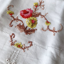 Load image into Gallery viewer, Lovely vintage white cotton pillowcases cross-stitch embroidered florals in shades of pink, yellow green, brown and white. A lovely addition to your bedding collection.

Excellent condition, no stains or tears.

Measures 31 1/2 x 20 inches
