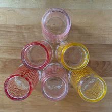 Load image into Gallery viewer, Glassware dreams are made of these beauties! This is a fantastic set of six vintage mid-century beverage glasses decorated in pairs with a pink, yellow or red basketweave pattern topped with a band of white ivy. Produced by Federal Glass, circa 1950s. The perfect addition to any style vintage kitchen and your tablescape will thank you!   In like new condition, free from chips/wear. The paint is vibrant and shiny. Unmarked.  Measures 2 1/2 x 4 1/2 inches  Capacity 12 ounces
