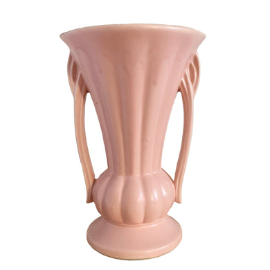 Beautiful vintage matte pink classically shaped handled trumpet vase. Crafted by McCoy Pottery, 1940s. This vase is must for any art pottery collector!

In excellent vintage condition, no chips, no cracks, no repairs. Maker's mark on the bottom.

Measures 6 1/4 x 9 1/4 inches