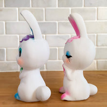 Load image into Gallery viewer, Adorable kitschy pink and blue bunny rabbit couple Bun-Bun chalkware figurines with the sweetest expressions and flower details. Crafted in Taiwan, 1970s. New old stock in original box. Cute doesn&#39;t quite capture these sweethearts!

In excellent condition, new in original shipping box.

Measures approximately 2 5/8 x 2 7/8 x 6 3/4 inches
