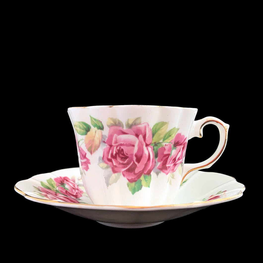 This vintage bone china scalloped shaped teacup and saucer featuring pink roses and gold gilt details. Crafted by Royal Stuart, England, 1948 - 1960. A lovely way to enjoy a cuppa tea.

In excellent condition, no chips, cracks or repairs. Maker's mark on the bottom.

Teacup measures 3 1/2 x 2 3/4 inches | Saucer measures 5 7/8 inches