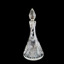 Load image into Gallery viewer, Add a touch of elegance to your tablescape with this antique vintage American Brilliant cut crystal cruet featuring a stunning pinwheel design with faceted stopper and handle. Crafted in the USA, early 20th century. Bring a little sparkle to your home with this lovely cruet.

In excellent condition, no chips.

Measures 3 1/2 x 8 inches
