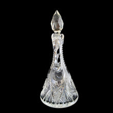 Load image into Gallery viewer, Add a touch of elegance to your tablescape with this antique vintage American Brilliant cut crystal cruet featuring a stunning pinwheel design with faceted stopper and handle. Crafted in the USA, early 20th century. Bring a little sparkle to your home with this lovely cruet.

In excellent condition, no chips.

Measures 3 1/2 x 8 inches

