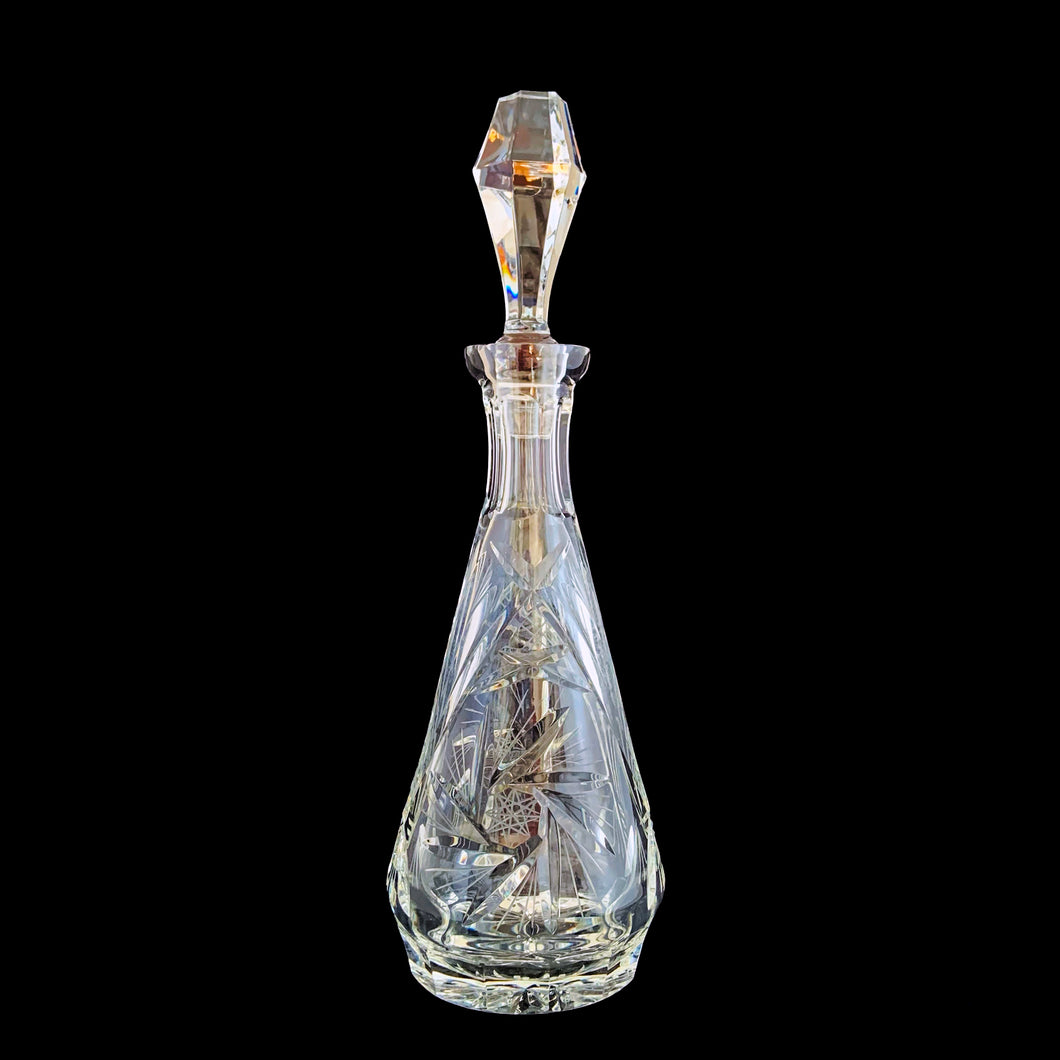 Vintage cut crystal liquor teardrop decanter featuring a pattern of pinwheels and fans. Crafted in Germany, circa 1950s. Add this eye catching crystal to your bar cart!

In excellent condition, no chips.

Measures 3 3/4 x 12 inches

Capacity 1 pint or 500ml