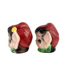 Load image into Gallery viewer, Vintage mid-century hand painted ceramic pixie elf salt and pepper shakers. These Christmas themed shakers are nicely painted in red, green, white black and yellow. Crafted by Lefton, Japan, 1950s. These highly collectible kitschy shakers are the perfect accent for your Christmas holiday decor!

The shakers are in excellent condition, no chips/cracks/repairs. One is missing the cork. Marked 6981 Japan.

Shakers measures approximately 2 3/4 x 2 1/4 x 3 inches
