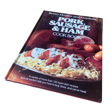 Load image into Gallery viewer, Better Homes and Gardens is known for its fabulous cookbooks. This hardcover cookbook focuses on Pork, Sausage &amp; Ham recipes. Its 96 pages are filled with amazing recipes along with many colour photographs. Originally published by Meredith Corporation, USA, 1979. This is the first edition, forth printing, 1981.

In great vintage condition.
