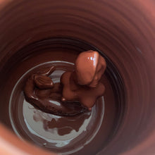 Load image into Gallery viewer, Rare vintage handmade Poseidon and Mermaid redware pottery mug finished in high fired two tone blue glaze on the exterior and a clear glazed interior. This large mug features a figural god of the sea wrapped around the exterior and mermaid in the interior of the mug. Crafted by KD Gandas, Lithuania 1990s. The perfect vessel for your favourite hot beverage!

In excellent condition with original sticker and impressed maker&#39;s mark.

Measures 6 1/4 x 4 1/4 x 6 1/2 inches (incl. handle)

Capacity 16 ounces

