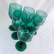 Load image into Gallery viewer, Set of eight vintage Premiere dark green water goblets or wine glasses. Crafted by Libbey Glass, USA, 1997 - 1998. The colour is absolutely fabulous and reminiscent of the deep dark delicious forest.

In excellent condition, no chips.

Measures 2 3/4 x 7 1/4 inches

Capacity 11 ounces
