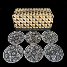 Load image into Gallery viewer, Vintage set of six Prescut Clear pressed glass coasters featuring a pattern of stars and pinwheels with a sawtooth rim. Crafted by Anchor Hocking, 1960s. Keep your furniture and tablecloths free from stains with these beauties.

In excellent condition, no chips. In original box.

Measures 3 1/4 x 1/2 inches
