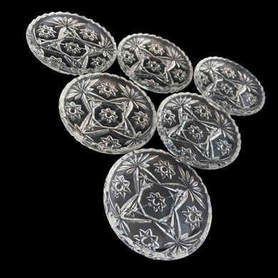 Vintage set of six Prescut Clear pressed glass coasters featuring a pattern of stars and pinwheels with a sawtooth rim. Crafted by Anchor Hocking, 1960s. Keep your furniture and tablecloths free from stains with these beauties.

In excellent condition, no chips. 

Measures 3 1/4 x 1/2 inches