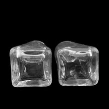 Load image into Gallery viewer, Sail away to flavor-town with this retro vintage set of salt and pepper shakers! These retro-style clear pressed glass shakers feature smooth sides and plasticized chrome screw-on lids. Crafted by Anchor Hocking, circa 1990s. Season your food with a real blast from the past!   The glass is in excellent condition, free from chips/cracks. The lids have very minor wear, see photos. Marked on the bottom.  Measures 1 5/8 x 4 1/8 inches
