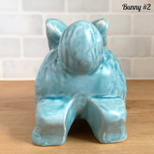 Load image into Gallery viewer, Vintage Easter bunny figurine back view Price Bros Burslem England 1950s aqua blue ceramic cottageware collectible
