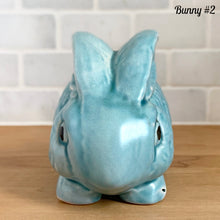 Load image into Gallery viewer, Vintage Price Bros aqua blue Easter bunny figurine 1950s England ceramic cottageware collectible spring decor front view
