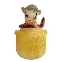 Load image into Gallery viewer, Adorable vintage, mid-century era Pup in the Pot ceramic cookie jar. Crafted by American Bisque, 1950s. A delightful addition to your cookie jar collection and kitchen decor!

In as found vintage condition, no chips, hairline fracture to the base, normal crazing commensurate with age.

Measures 6 1/2 x 6 x 11 1/2 inches
