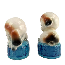 Load image into Gallery viewer, Vintage puppy dogs on blue poofs ceramic salt and pepper shakers with plastic stoppers. Imported by Giftcraft. Japan 1960s. Add these adorable and highly collectible shakers to your collection!

In excellent vintage condition, no chips/cracks/repairs. Giftcraft sticker on one shaker, otherwise unmarked.

Measures 2 x 1 3/4 x 3 1/4 inches
