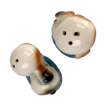Load image into Gallery viewer, Vintage puppy dogs on blue poofs ceramic salt and pepper shakers with plastic stoppers. Imported by Giftcraft. Japan 1960s. Add these adorable and highly collectible shakers to your collection!

In excellent vintage condition, no chips/cracks/repairs. Giftcraft sticker on one shaker, otherwise unmarked.

Measures 2 x 1 3/4 x 3 1/4 inches
