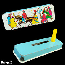 Load image into Gallery viewer, We have a selection of rare vintage Judaica tin lithograph Purim holiday noisemaker groggers. Crafted by US Metal Toy Manufacturing Co., USA, circa 1960s/1970s. The graphics are incredible and it&#39;s so much fun to make some noise!!!

In good vintage condition each is in good working order.

Translation of the Hebrew on the blue grogger is The Jews had light and joy and happiness.
