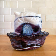 Load image into Gallery viewer, Rare vintage purple amethyst slag glass Owl-on-Nest covered bon bon dish. Crafted by LG Wright Glass, USA, 1959 - 1985. Perfect to store candies, trinkets, soap or beauty needs. Add this sweet piece of history to your glass or owl collection!  In excellent condition, no chips.  Measures 5 3/8 x 4 1/8 x 4 1/4 inches
