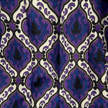 Load image into Gallery viewer, Transform any room into a vintage paradise with this pair of vibrant geometric, fully lined,&nbsp;pinch pleat curtain panels in bold shades of purple, blue, black, white and gold. The impeccable craftsmanship tells us they were made professionally made. An easy way to add mid mod flair and character to your home decor.

In excellent like-new condition, free from stains/tears measures 22 inches wide at the top, 40 inches wide at the bottom, 84 inches in length with a 3 1/4 inch hem. Includes 14 stainles
