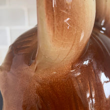 Load image into Gallery viewer, Adorable vintage, mid-century era anthropomorphic ceramic rabbit cookie jar. Crafted by Royal Sealy, Japan, 1950s. A delightful addition to your cookie jar collection and kitchen decor!

In as found vintage condition, with 2 chips to the rim of the lid and a well executed repair to one ear, see photos. No cracks and typical age-related crazing.

Measures 6 x 7 1/4 x 13 1/4 inches
