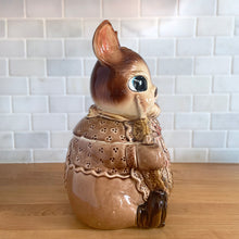 Load image into Gallery viewer, Adorable vintage, mid-century era anthropomorphic ceramic rabbit cookie jar. Crafted by Royal Sealy, Japan, 1950s. A delightful addition to your cookie jar collection and kitchen decor!

In as found vintage condition, with 2 chips to the rim of the lid and a well executed repair to one ear, see photos. No cracks and typical age-related crazing.

Measures 6 x 7 1/4 x 13 1/4 inches
