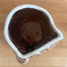 Load image into Gallery viewer, Adorable vintage, mid-century era anthropomorphic ceramic rabbit cookie jar. Crafted by Royal Sealy, Japan, 1950s. A delightful addition to your cookie jar collection and kitchen decor!

In as found vintage condition, with 2 chips to the rim of the lid and a well executed repair to one ear, see photos. No cracks and typical age-related crazing.

Measures 6 x 7 1/4 x 13 1/4 inches
