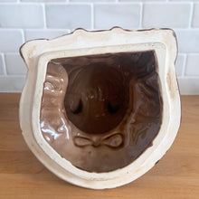 Load image into Gallery viewer, Adorable vintage, mid-century era anthropomorphic ceramic rabbit cookie jar. Crafted by Royal Sealy, Japan, 1950s. A delightful addition to your cookie jar collection and kitchen decor!

In as found vintage condition, with 2 chips to the rim of the lid and a well executed repair to one ear, see photos. No cracks and typical age-related crazing.

Measures 6 x 7 1/4 x 13 1/4 inches
