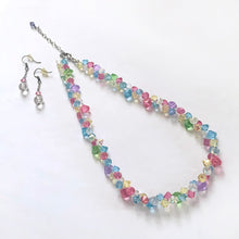 Load image into Gallery viewer, Turn heads with this stunning vintage Swarovski rainbow crystal jewelry set, featuring a radiant crystal choker necklace paired with perfectly matching earrings. Designed to sit elegantly at the collarbone, the choker sparkles with a vivid spectrum of multicolor crystals, while the coordinating earrings frame the face with the same iconic Swarovski brilliance.
