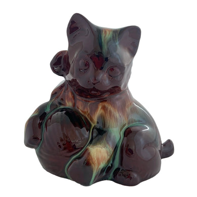 Playful vintage rainbow drip glazed redware ceramic cat figurine with bow and a ball of yarn. Crafted by CCC (Canadian Ceramic Craft, Canada, circa 1960s. A sweet piece to add to your CCC or cat collection. In excellent condition, free from chips/cracks/repairs. Measures 6 3/8 x 4 x 6 inches