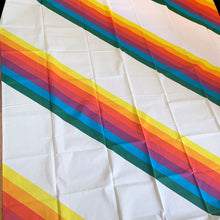 Load image into Gallery viewer, Let your authentic self represent with this vintage twin size flat poly cotton white bed sheet printed printed with rainbow stripes. Crafted by Thomaston, USA, 1970s. A great addition to any bedding collection, or repurpose for crafts, quilting or garment making.

Excellent like-new vintage condition, no stains/tears. Original label present. Colours are vibrant.

Measures 64 x 96 inches
