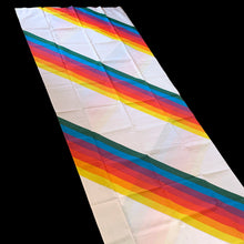 Load image into Gallery viewer, Let your authentic self represent with this vintage twin size flat poly cotton white bed sheet printed printed with rainbow stripes. Crafted by Thomaston, USA, 1970s. A great addition to any bedding collection, or repurpose for crafts, quilting or garment making.

Excellent like-new vintage condition, no stains/tears. Original label present. Colours are vibrant.

Measures 64 x 96 inches
