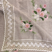 Load image into Gallery viewer, Vintage raw linen tablecloth embroidered with pink and white flowers and green leaves, finished with an intricate crocheted edge. A beautiful piece of linen to grace your table! In excellent condition, free from tears/stains. Measures 50 x 67 inches
