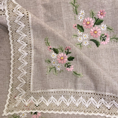 Vintage raw linen tablecloth embroidered with pink and white flowers and green leaves, finished with an intricate crocheted edge. A beautiful piece of linen to grace your table! In excellent condition, free from tears/stains. Measures 50 x 67 inches