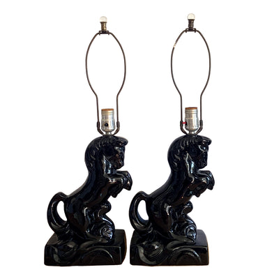 Fabulous pair of vintage rearing black horse ceramic table lamps with brass harps and clear glass marble finials. 1960 or 1970s era judging by the cords and straight pronged plug. These lamps bring all the retro vibes to your home decor!

Both lamps are in excellent condition, no chips/cracks/repairs. New felt on the bottom of each lamp.

Measurements: 7 1/2 x 5 x 12 inches (23 1/2 inches to top of finial)

Suitable for a 9 or 10 inch shade