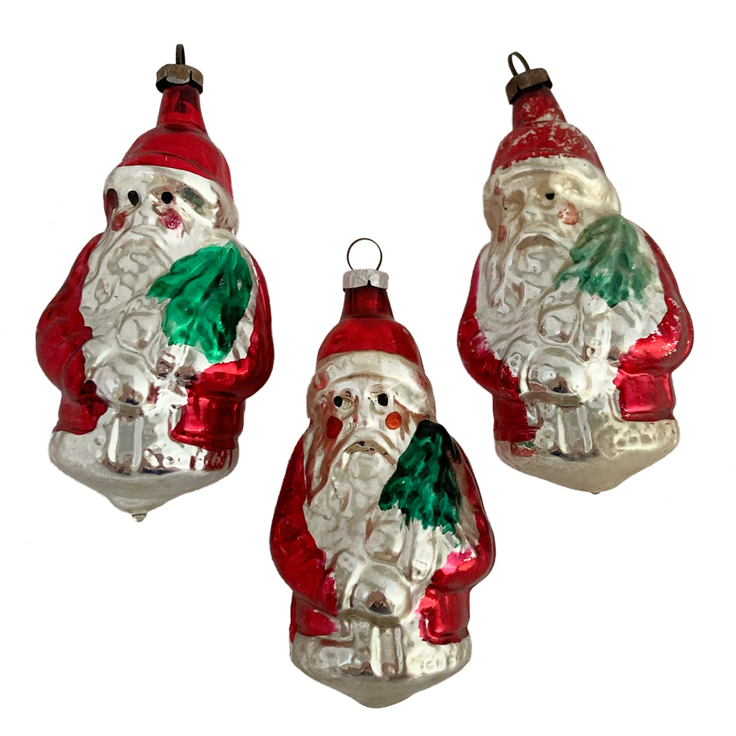 Stunning vintage red and silver mercury glass figural Santa Claus holding a green Christmas tree decorated with white sugar texture, Christmas tree ornament. Made in Germany. Perfect for the tree or dress up your holiday decor.

In vintage condition. Marks are indecipherable.

Measures 3 1/2 inches