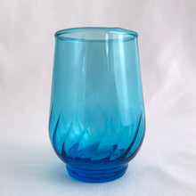 Load image into Gallery viewer, Vintage swirl optic &quot;Regal Laser Blue&quot; 6 ounce flat tumbler glass. Produced by the Anchor Hocking Glass Company, USA, circa 1970s. The colour of these glasses is electric!   In excellent condition, free from chips/cracks.  Measures 2 1/2 x 3 1/2 inches  Capacity 6 ounces.  We have 2 in stock, price individually.
