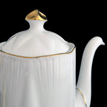 Load image into Gallery viewer, Vintage &quot;Regency&quot; fine bone China mini coffee pot and lid in white with gold gilt details. on the Dainty shape. Crafted by Shelley, England, 1945-1966. A must-have for the collector! In excellent condition, free from chips/cracks/repairs. Measures 3 1/4 x 5 7/8 inches tall (not incl. handle/spout)
