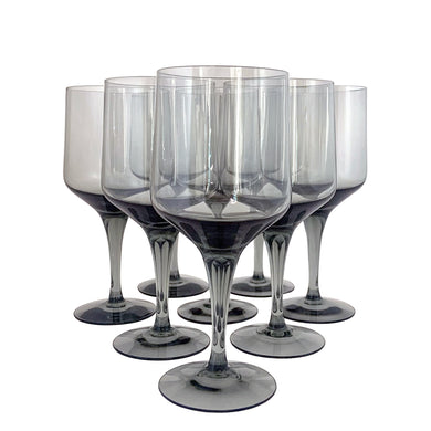 Set of eight vintage modernist style smoke gray Rhapsody tall water goblet glasses. Crafted by Orrefors Glassworks, Sweden, 1967 - 1991. Add elegance to your barware collection with this stunning blown glass stemware.

In excellent condition, no chips.

Measures 3 x 7 1/4 inches

Capacity 12 ounces