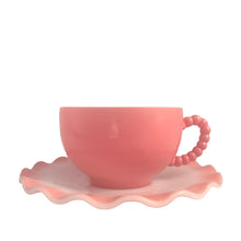Load image into Gallery viewer, Sweet vintage mid-century era Ripple Pink aka Pink Crinoline milk glass tableware. Crafted by Hazel-Atlas Glass, USA, 1950s. The lovely tableware has a pretty ruffled pink edge on white milk glass and the cups and creamer have a beaded handle. A beautiful way to set a table! Beaded Handle Cup and Saucer. In as found vintage condition, no chips, with age-related wear.

