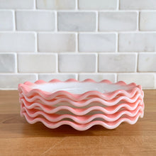 Load image into Gallery viewer, Sweet vintage mid-century era Ripple Pink aka Pink Crinoline milk glass tableware. Crafted by Hazel-Atlas Glass, USA, 1950s. The lovely tableware has a pretty ruffled pink edge on white milk glass and the cups and creamer have a beaded handle. A beautiful way to set a table! Saucer. In as found vintage condition, no chips, with age-related wear.

