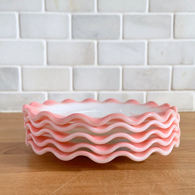 Sweet vintage mid-century era Ripple Pink aka Pink Crinoline milk glass tableware. Crafted by Hazel-Atlas Glass, USA, 1950s. The lovely tableware has a pretty ruffled pink edge on white milk glass and the cups and creamer have a beaded handle. A beautiful way to set a table! Saucer. In as found vintage condition, no chips, with age-related wear.