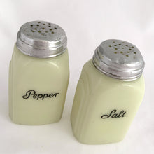 Load image into Gallery viewer, Vintage &quot;Roman Arch&quot; custard uranium glass salt and pepper shaker with the words Salt and Pepper in crisp black script. Produced by McKee Glass, USA, 1930 - 1951. These art deco beauties glow brilliantly under black light and will make a great addition to any vintage kitchen collection!
