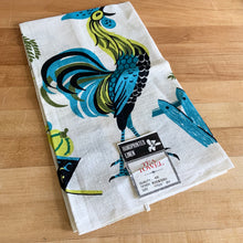 Load image into Gallery viewer, Stunning vintage mid-century era cream coloured linen tea towel featuring a hand printed rooster and farm graphics in shades of blue, green and black. An artful addition to your vintage or contemporary kitchen decor.  This piece is new old stock with original tag. In excellent condition. Made in Hungary.  Measures 17 x 29 inches   
