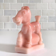 Load image into Gallery viewer, Vintage rosaline slag glass Oscar plug horse figurine. Originally designed and produced by Heisey Glass 1941 - 1946. Reproduction crafted with original mold by Fenton Art Glass, 1990. Marked with HCA 90 and Fenton logo. Only 1267 of the rosaline plug horses were made, making it highly collectible. This playful horse is perfect to start or add to your collection or to gift to the animal lover in your life! New old stock, in excellent condition, free from chips. Measures approximately 4 x 1 1/2 x 4 inches
