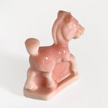 Load image into Gallery viewer, Vintage rosaline slag glass Oscar plug horse figurine. Originally designed and produced by Heisey Glass 1941 - 1946. Reproduction crafted with original mold by Fenton Art Glass, 1990. Marked with HCA 90 and Fenton logo. Only 1267 of the rosaline plug horses were made, making it highly collectible. This playful horse is perfect to start or add to your collection or to gift to the animal lover in your life! New old stock, in excellent condition, free from chips. Measures approximately 4 x 1 1/2 x 4 inches
