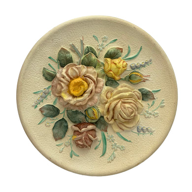 Vintage Rose round ceramic wall plaque, C-5730 featuring three dimensional pink and yellow roses. Ceramic crafted by Napco, Japan and hand painted in USA. Bring a touch of cottage charm to your decor with this lovely piece. In great vintage condition, no chips. Marked Hand Painted ©1962, NAPCO, Bedford, OH. Japan, C-5730 Rose. Measures 10 1/2 inches