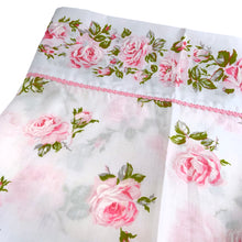 Load image into Gallery viewer, Lovely vintage &quot;Rose Romance&quot; white flat bed sheet printed with&nbsp;a pattern&nbsp;pink roses and finished with a pink lace edge. This 50% polyester / 50% cotton sheet fits a queen sized bed. Crafted by Texmade, Canada, circa mid 1970s. A beautiful addition to your bedding collection, or repurpose for crafts, quilting or garment making.  In excellent vintage condition free from stains/tears. Original label present.  Sheet measures 88 x 100 inches  Fits a queen size mattress 60 x 79 1/2 inches
